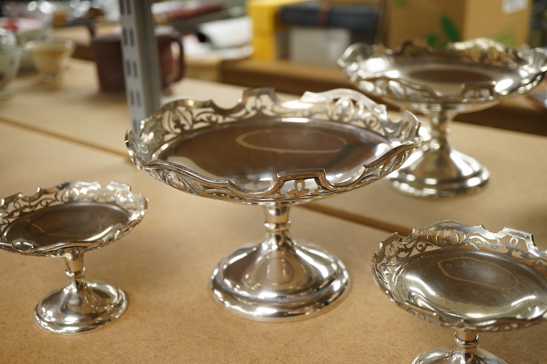 A suite of three George V graduated comports, by Stuart Dawson & Co Ltd, London, 1911, with pierced borders, comprising a large comport height 11.9cm and pair of smaller comports, height 7.2cm, 20oz.